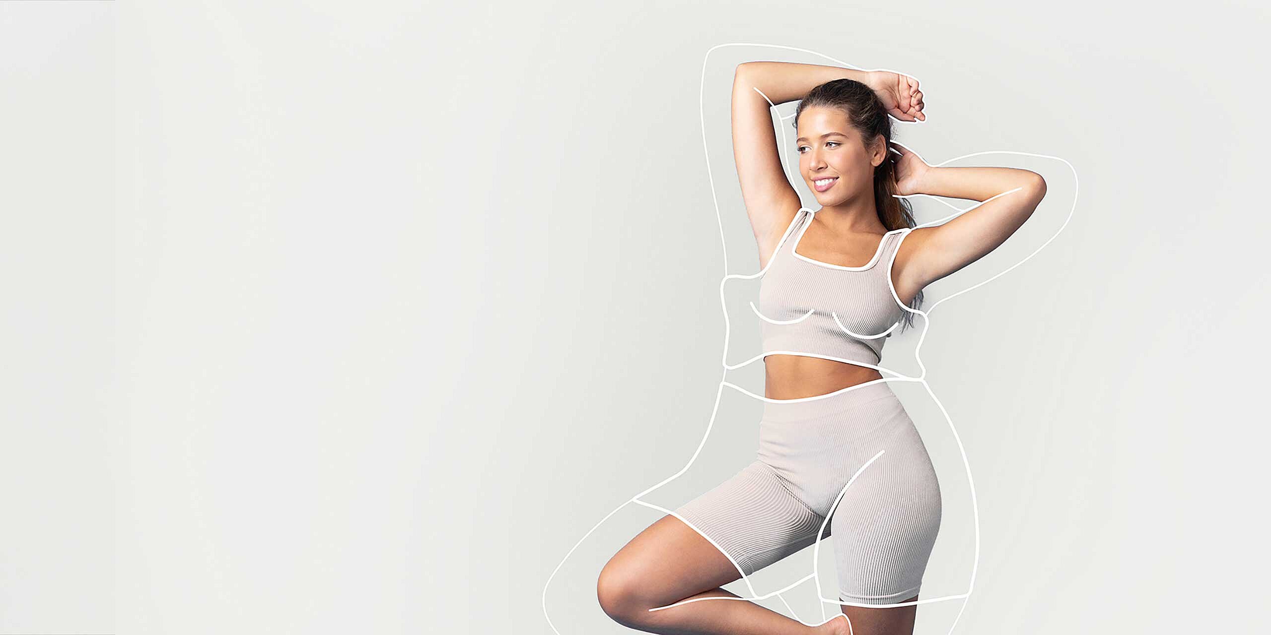 Junge Frau in Fitnessoutfit mit aufgezeichneten Konturen um den Körper